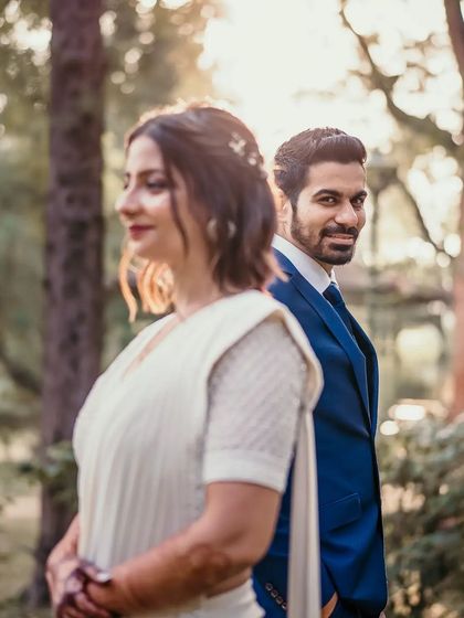 A playful glance from the groom over his shoulder. This candid moment is full of charm and personality, capturing the fun side of their relationship.