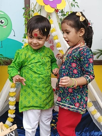 Dressed in their festive best, these children share a happy moment during our Rakshabandhan celebration.