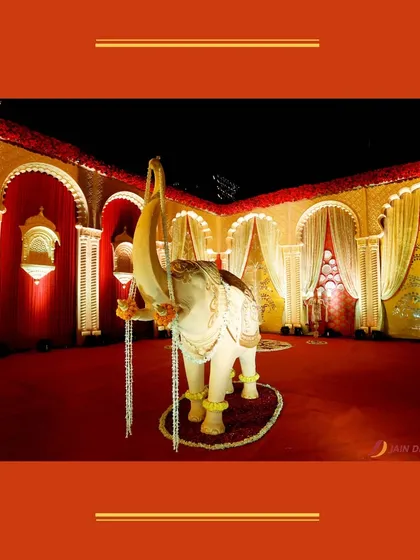 A beautifully decorated elephant statue, a symbol of good luck and prosperity, welcomes guests to the celebration.