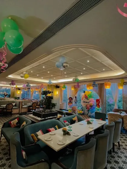 An overview of the Cocomelon party venue, showing how I use ceiling balloons and themed decor to transform the entire restaurant space.