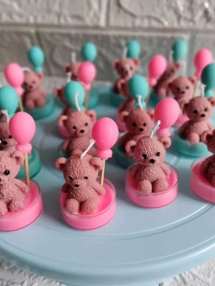 A batch of my cute teddy bear with balloon candles in pink and blue. These small, scented soy wax candles are ideal for baby showers or birthday favors.