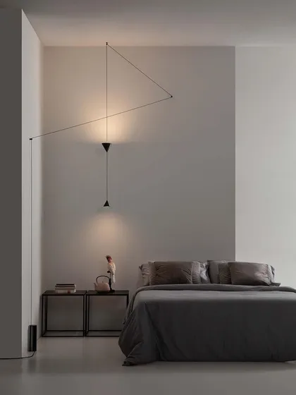 The Filomena system can also provide both direct and indirect light. Here, one cone points down for task lighting, while another points up to wash the wall with a soft glow.
