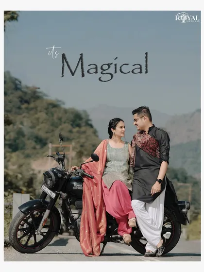 A beautiful portrait of a couple in traditional attire with their bike, captioned 'It's Magical', highlighting a unique theme combination.