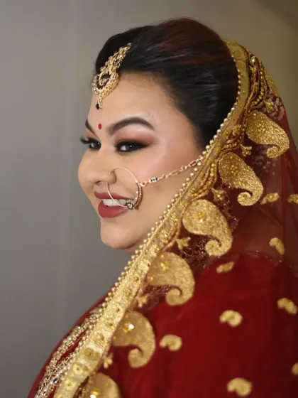 The side profile highlights the beautiful details of her look, from the intricate dupatta setting to the perfectly winged eyeliner and nath.