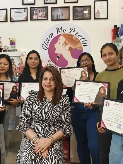 Posing with my newly certified makeup artists. Their journey at the academy has been incredible, and I am excited for their future.
