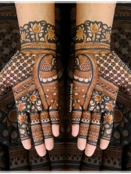 A lovely back-hand design with a peacock and lotus motif. The use of negative space makes the design pop.
