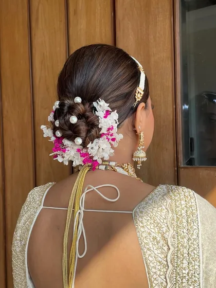 A close-up of the back of the pearl and hydrangea bun, showing the intricate placement of each flower and pearl.