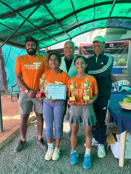 The whole team celebrating a successful tournament outing. Our players and coaches pose with the trophies from the U16 singles and doubles victories in Nagpur.