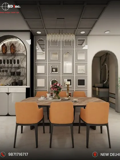 A sophisticated dining room featuring a custom-built bar and crockery unit with an arched design. The space is tied together with a grid of mirrors on the feature wall, adding depth and reflecting the light from the elegant chandelier.