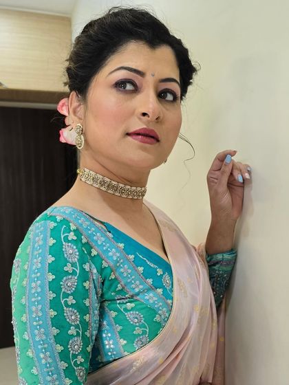 A striking portrait. The makeup is designed to look sophisticated and timeless, perfect for any celebrity appearance.