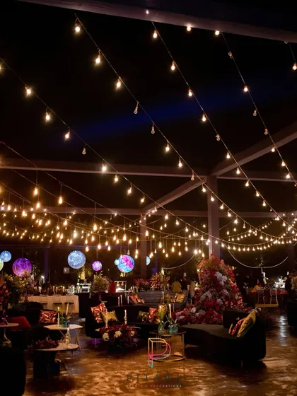 For a truly out-of-this-world experience, we created this cosmic-themed sangeet. A canopy of string lights mimics a starry night sky, while custom planet decor floats above the lounge areas, creating a celestial vibe for the celebration.