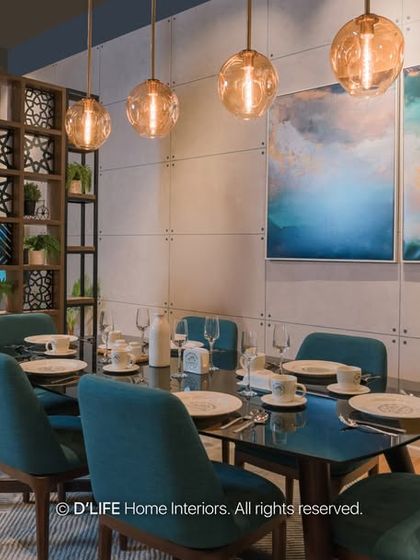 A different angle of the dining space, showing the elegant table setting and the artistic room divider that separates the living area while maintaining an open feel.