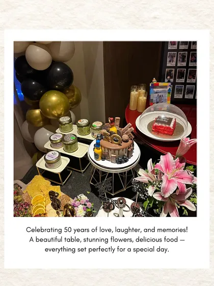 A beautifully styled dessert table celebrating 50 years of love, laughter, and memories, complete with a gorgeous cake, flowers, and a cheese board.
