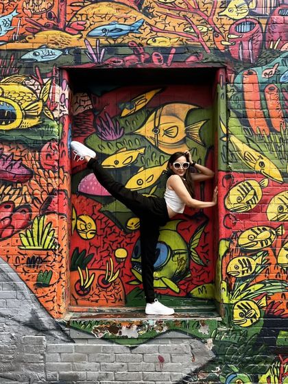 Another shot from the colorful graffiti alleys of Toronto. Art, travel, and yoga are three of my favorite things.