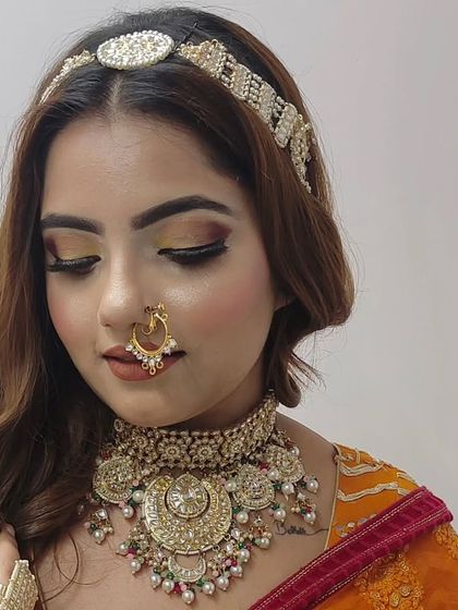 A close-up of a unique, oversized Polki choker with multi-colored accents. This piece is perfect for a bride who wants something bold and different.