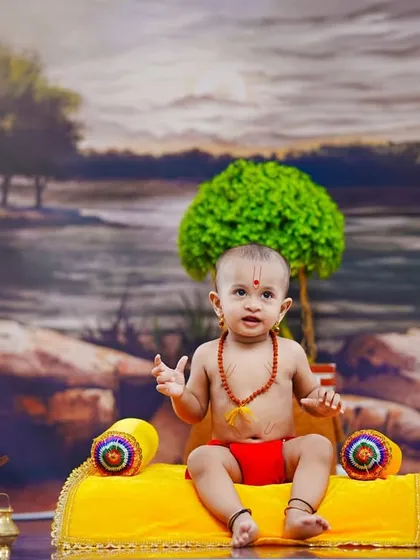 A wide view of the Swami Samarth theme, showing the full backdrop and props like the holy book and fruit offerings.