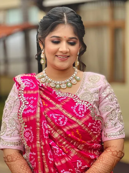 A beautiful look for a Mayra ceremony, featuring a traditional bandhani dupatta and a soft, elegant makeup look.