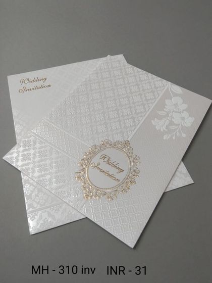 This simple white invitation has a textured background and a classic gold emblem. It's a clean and budget-friendly choice for a formal announcement.