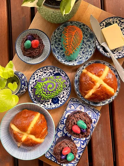 My Easter menu is a limited run of festive treats. Here you can see my brioche hot cross buns, Easter nest cupcakes, and hand-decorated almond marzipan eggs.