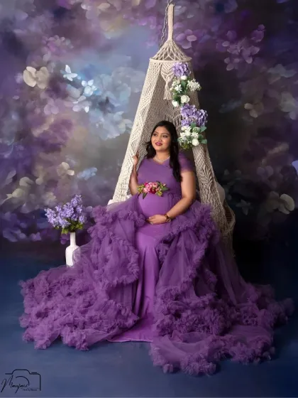 A beautiful solo portrait on the swing, capturing a moment of quiet reflection and anticipation. The purple tones add a touch of royalty and magic.