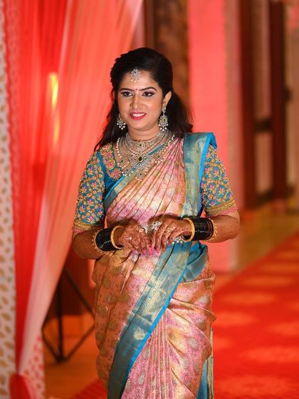 Rashmi making her entrance at the reception. Her modern hairstyle and sparkling diamond jewellery complete her elegant evening look.