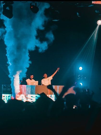 On stage at IIT Patna, with blue smoke cannons adding to the atmosphere.