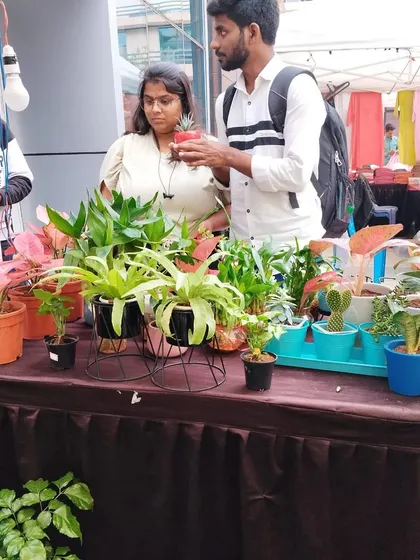 I enjoy talking to fellow plant lovers and helping them find the right plant. Here I am at the Embassy Tech Village bazaar, discussing a small succulent with a customer.