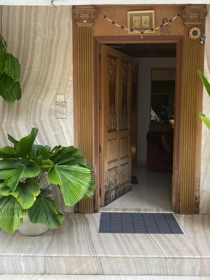 We help you make a welcoming first impression at home. This entryway is enhanced with a curated selection of potted plants, including a Fan Palm and Bird of Paradise, in stylish FRC planters that add life and character to the entrance.