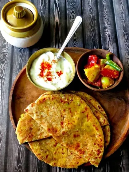 A classic breakfast of champions. Our hot, stuffed parathas are served with cool curd and tangy homemade pickle. It’s the perfect way to start your day with a wholesome and filling meal.