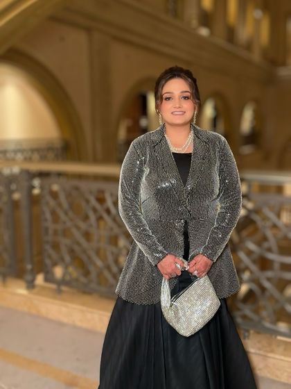 Another shot of the full look. The makeup is sophisticated and chic, perfect for an international wedding event.