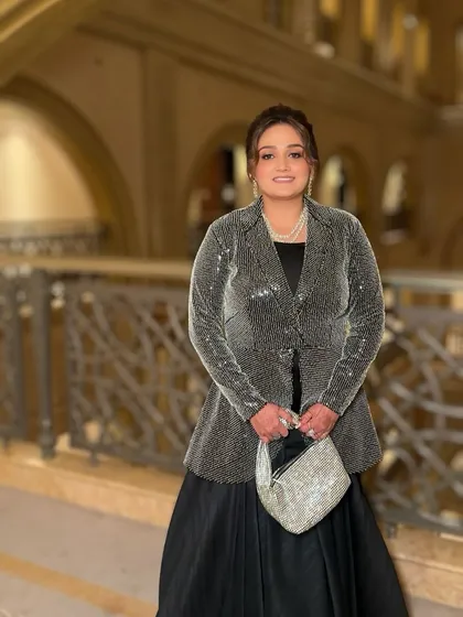 Another shot of the full look. The makeup is sophisticated and chic, perfect for an international wedding event.