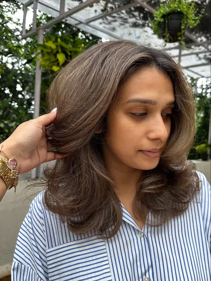 When you need a color refresh, I've got you. I took her faded highlights and toned them to this beautiful, cool-toned brunette, blending everything for a sophisticated and polished finish.