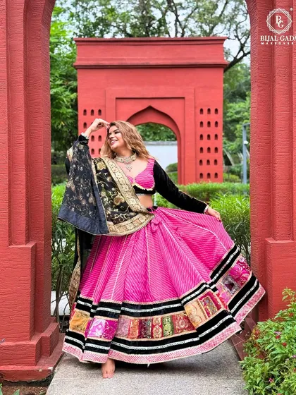 Another angle of the vibrant Navratri outfit, capturing the movement and festive spirit. The makeup is glamorous yet traditional, perfect for dancing the night away.