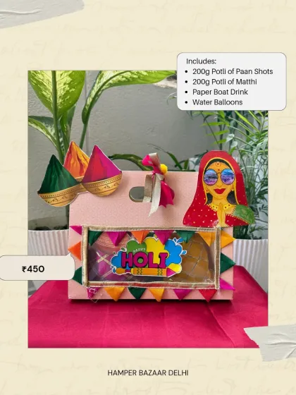 Our Paper Bag Holi Hamper is a great budget option at ₹450. It includes potlis of paan shots and matthi, a Paper Boat drink, and water balloons, all in a cute, decorated bag.