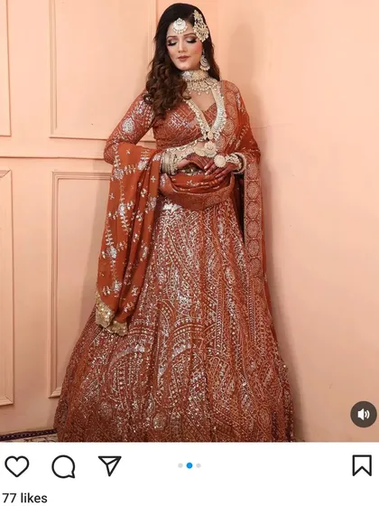 A beautiful rust-coloured lehenga with all-over silver work. This unique colour is perfect for an autumn wedding or a reception party.