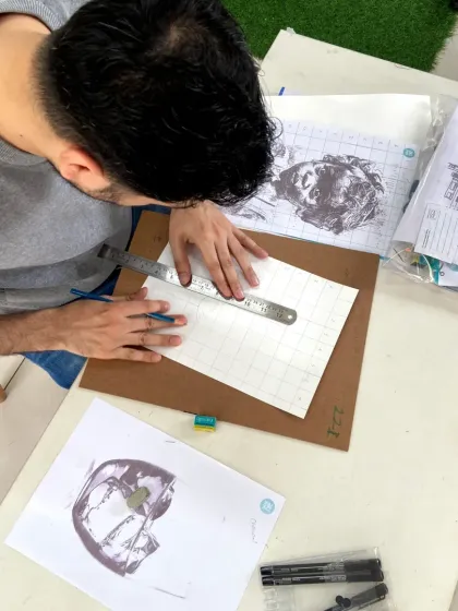 Using the grid method, this student is tackling a complex architectural sketch with confidence.