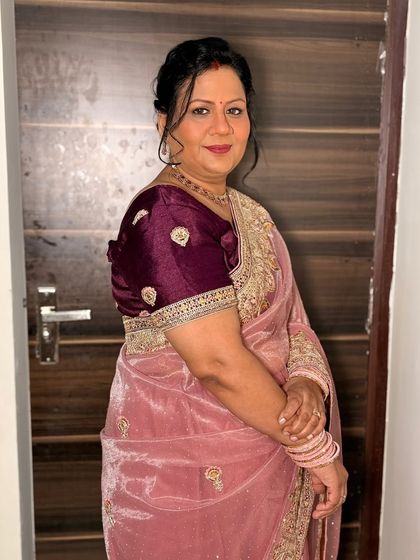 A side profile of the client, showing her elegant updo.