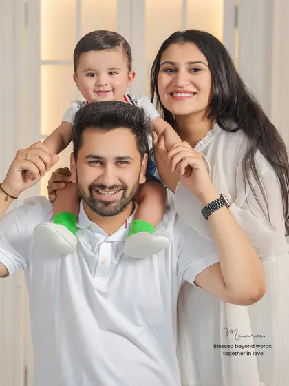 A beautiful family of three, perfectly posed and smiling for the camera. This is a classic family portrait that will be cherished for years.
