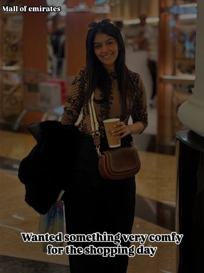 For a long day of shopping at the Mall of the Emirates, I chose a comfy knit top and black skirt. Practical footwear is a must.