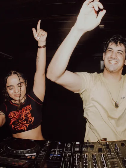 All smiles behind the decks. This candid shot captures the pure fun and connection I feel when I'm sharing music. The energy exchange between me and the crowd is everything.