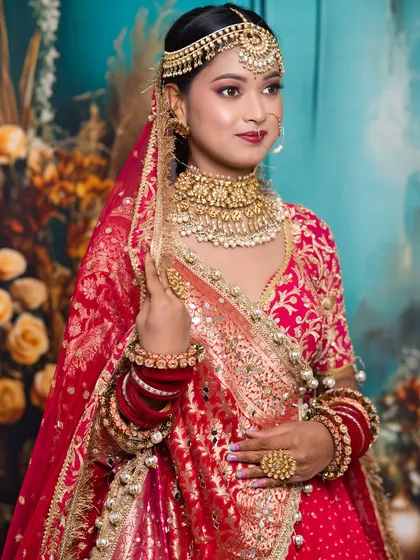 A beautiful portrait of the bride, showcasing the student's skill in creating a look that is both traditional and photogenic.