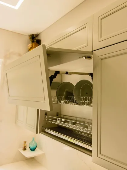 Another view of the dish rack cabinet, showing how easily it can be accessed. The mechanism is designed to be smooth and hold the door open securely.