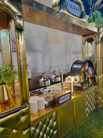 The live pizza-making area, complete with all the necessary ingredients and equipment for a true Italian experience.