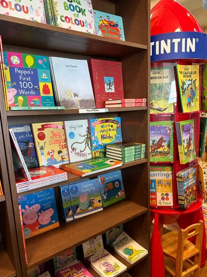 Our bookstore is filled with classics and new favorites. You can find beloved Tintin comics on our special rocket-ship display stand, alongside a great collection of Peppa Pig and other picture books.