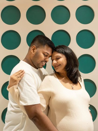 Finding fun spots in your own home for photos! The unique patterned wall in their house made for a cool and modern backdrop for this sweet, close-up couple's portrait.