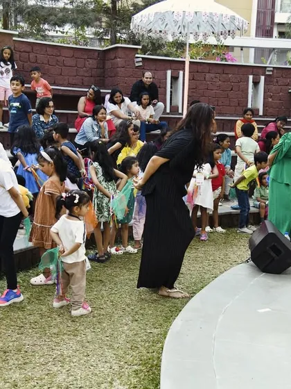 We love getting off the stage and interacting directly with the children. Here, we are leading a call-and-response activity with the young audience at an outdoor festival.