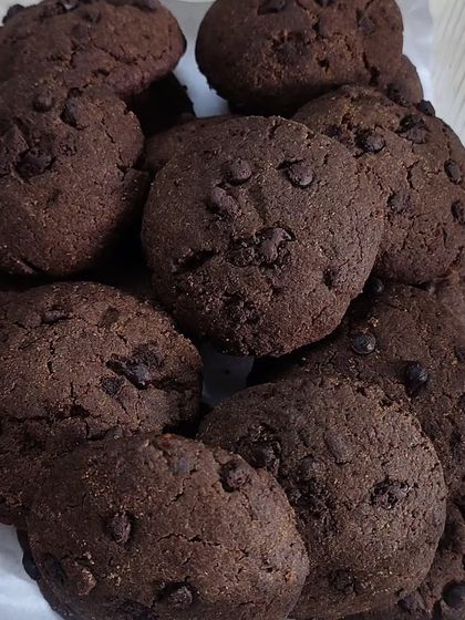 A close-up of my healthy jaggery and wholewheat chocolate chip cookies. They are soft, chewy, and packed with chocolate chips, proving that healthy can also be delicious.