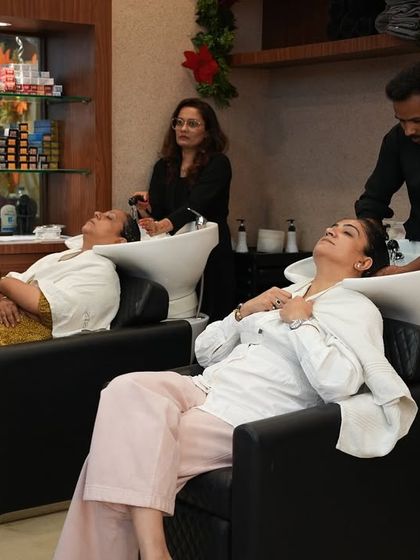 My guests are my true friends. Here, two clients are enjoying a relaxing hair wash side-by-side, sharing a moment of pampering and friendship in my salon.