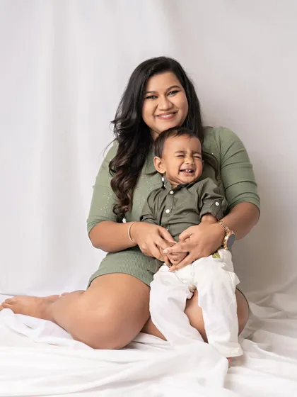 A mother and son share a laugh. The joy in this photo is absolutely contagious.