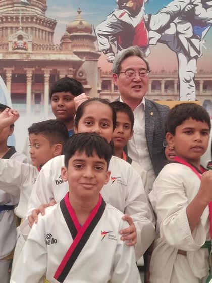 A close up with one of the Kukkiwon masters and our young students. These interactions are invaluable, inspiring our kids to aim for global standards in Taekwondo.